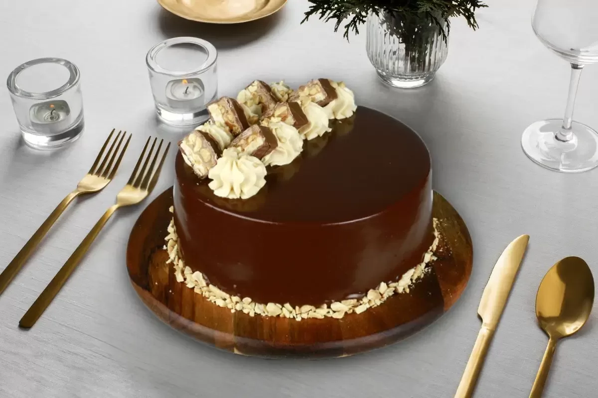 A chocolate cake made by Matilda Cakes with snicker chocolate topping. 
